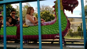 Auntie Sarah and cousin Milah on the dragon/castle ride