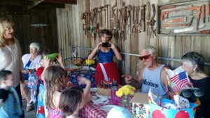 Papa blowing out the candles and being silly with the great grandkids